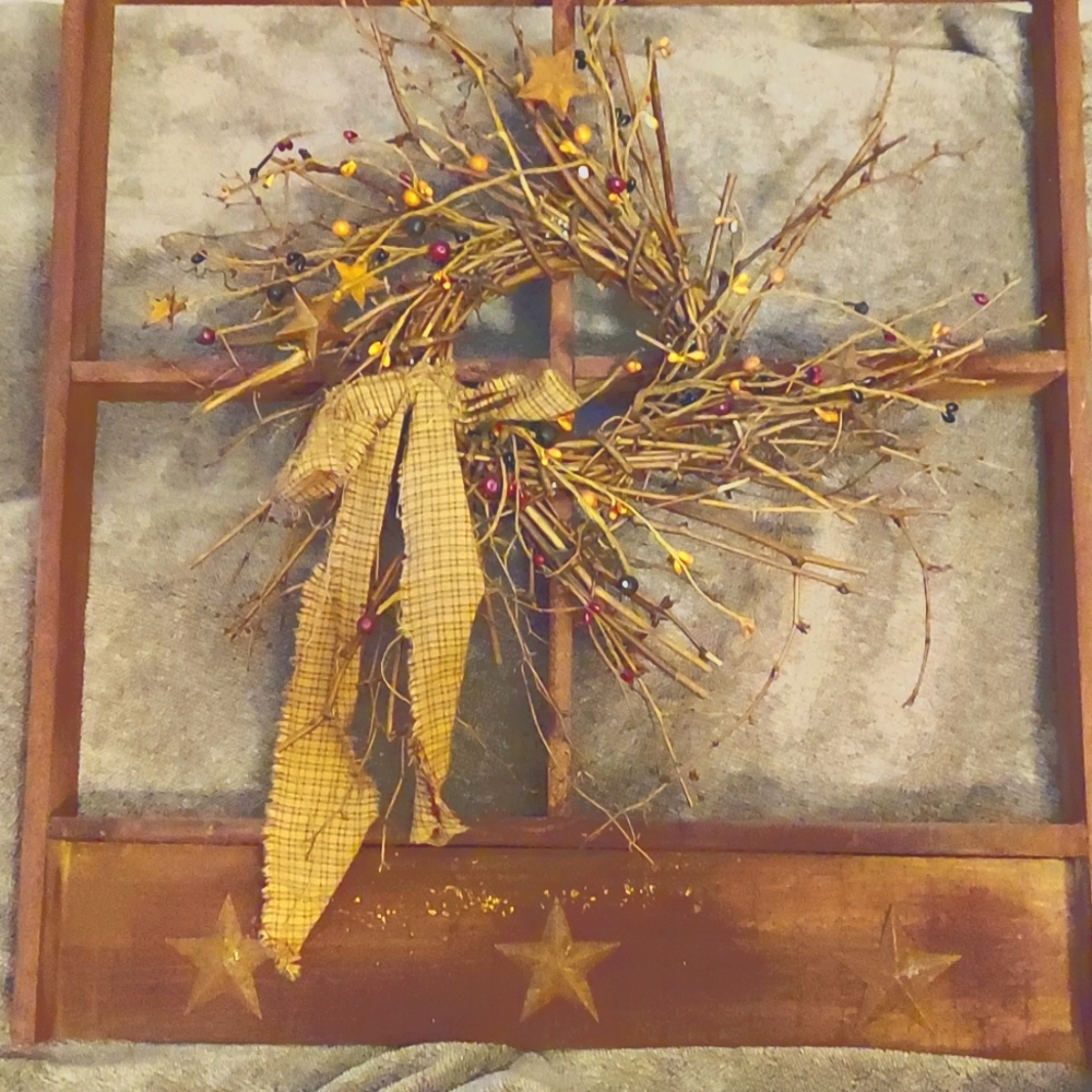 Primitive window with grapevine wreath